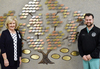 Kathy Waddell (left) and Andrew Porter (right) stand in front of the Wayne General Hospital Foundation's Giving Tree.