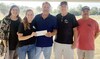 Waynesboro Mayor Richard Johnson (center) donated $10,000 to Lion Fest to help cover expenses for Saturday's Fellowship at the Fields.